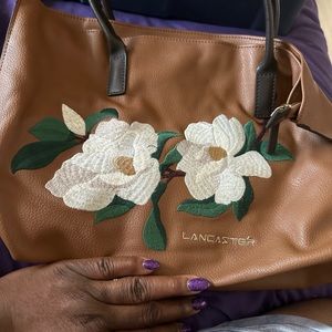Lancaster bag, leather with floral design.